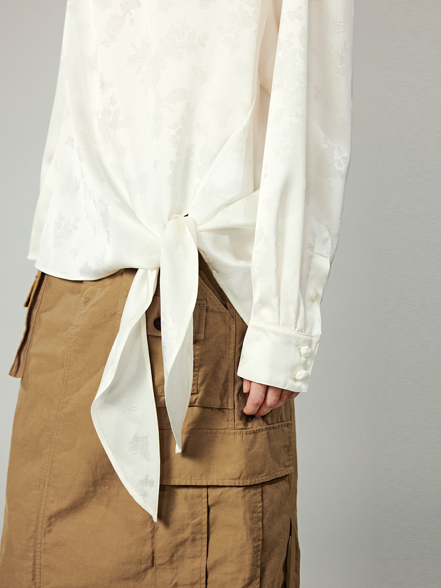 Modern chinese-style embroidered button shirt with tie hem detail