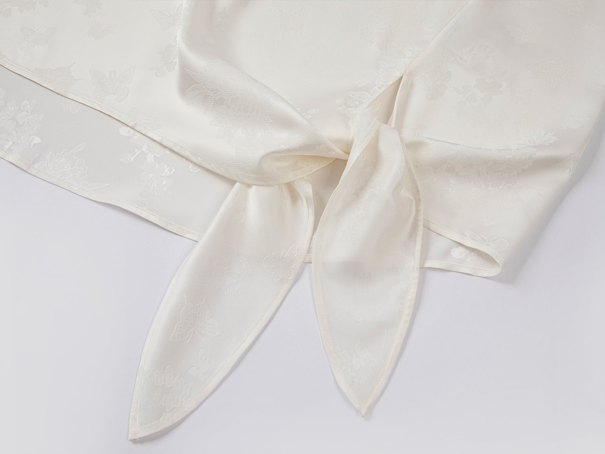 Modern chinese-style embroidered button shirt with tie hem detail