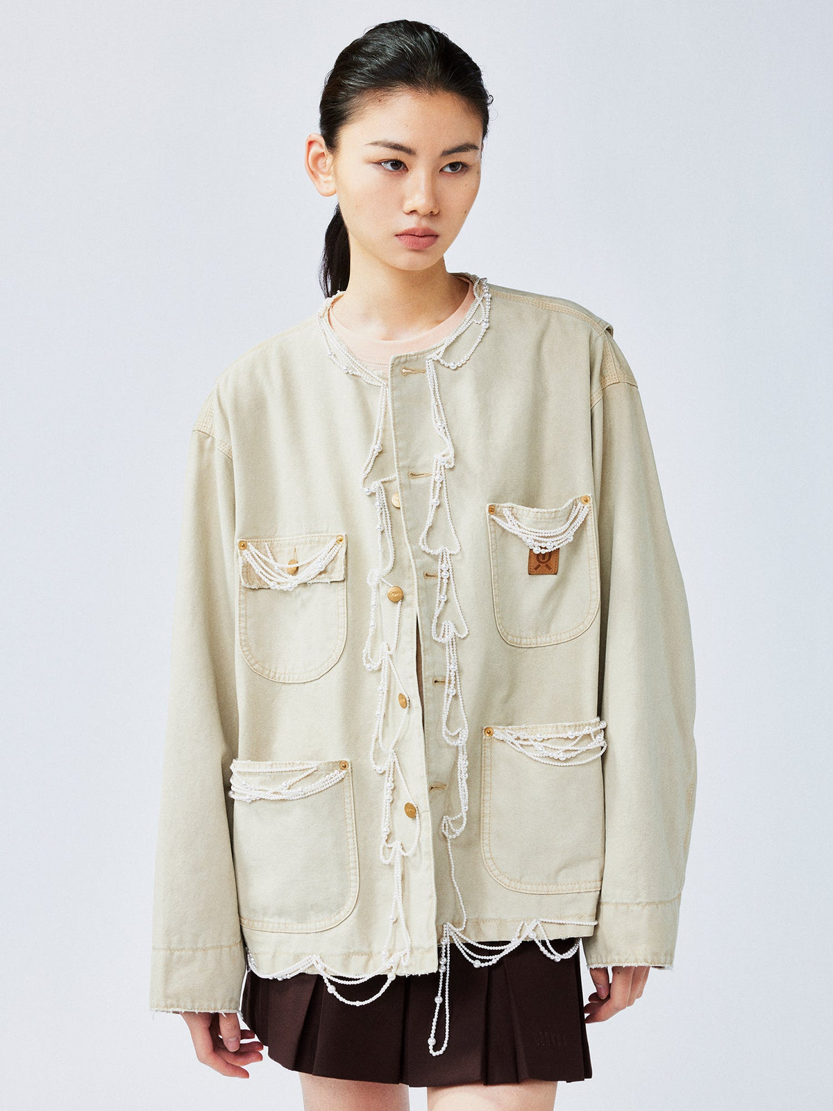 Elegant and lively pearl chain Michigan jacket