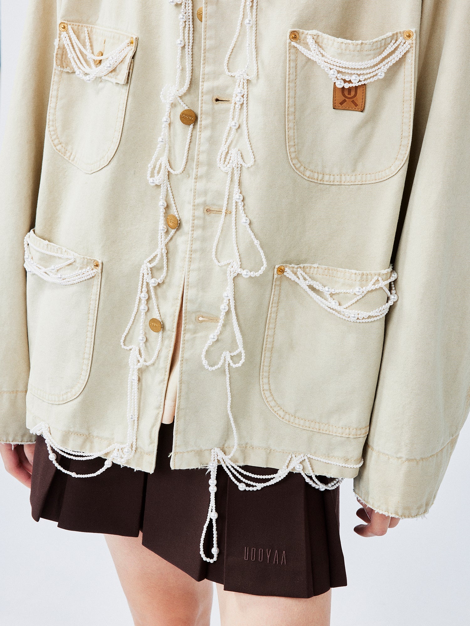 Elegant and lively pearl chain Michigan jacket