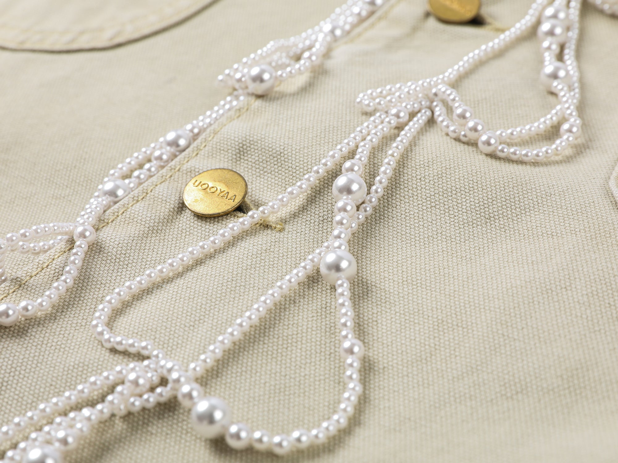 Elegant and lively pearl chain Michigan jacket