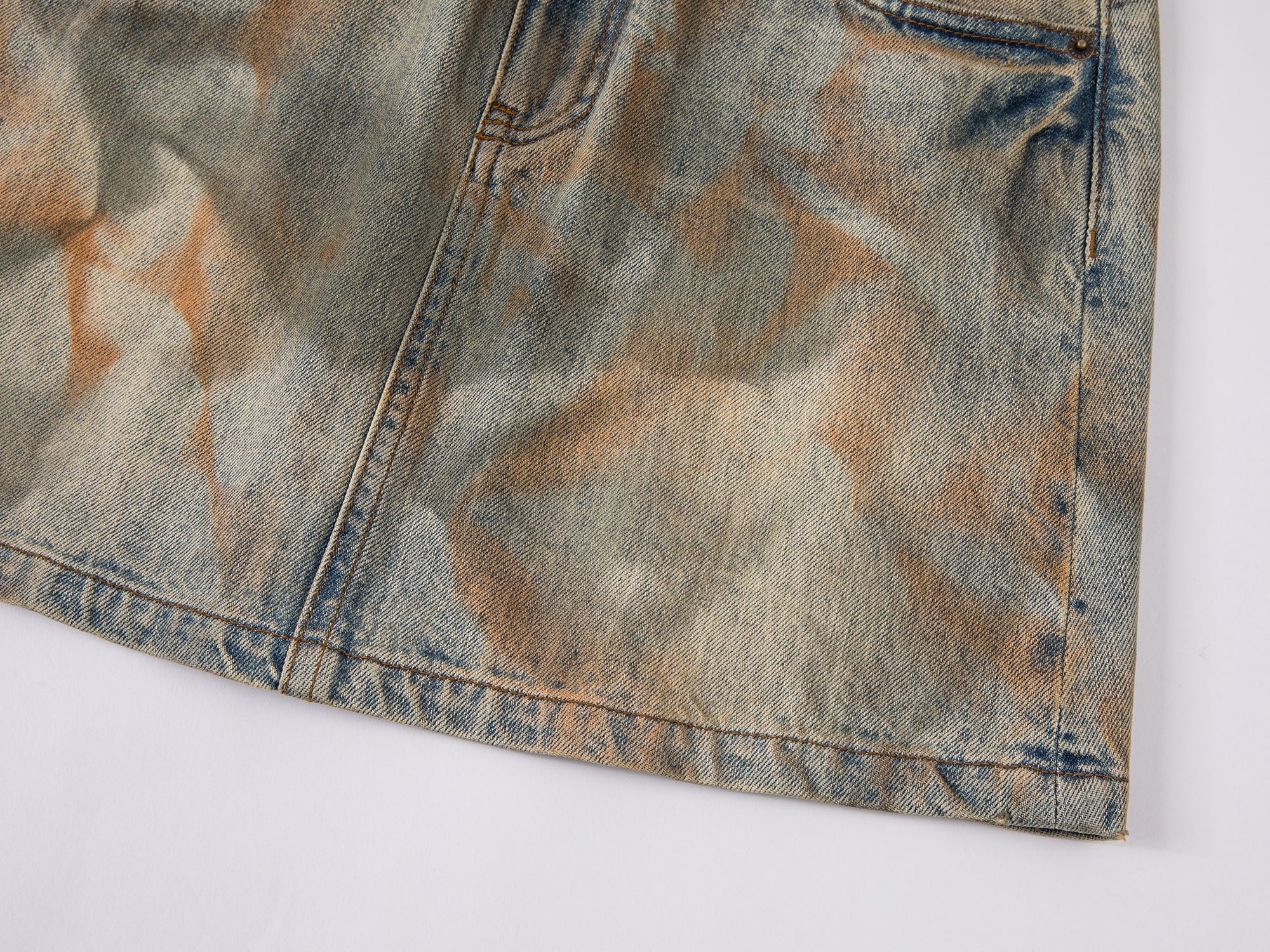 Deconstructed dirty washed denim short skirt