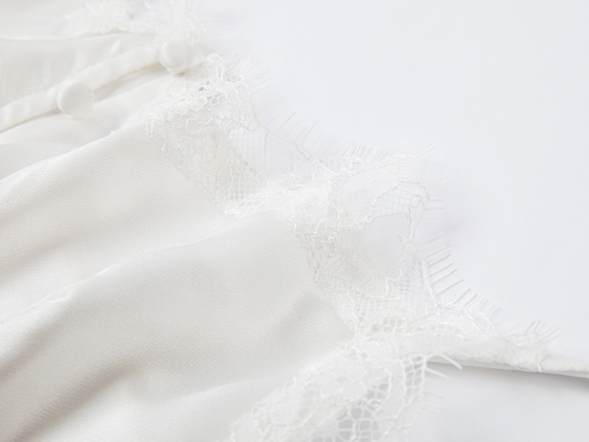 Lace-trimmed cami top in white