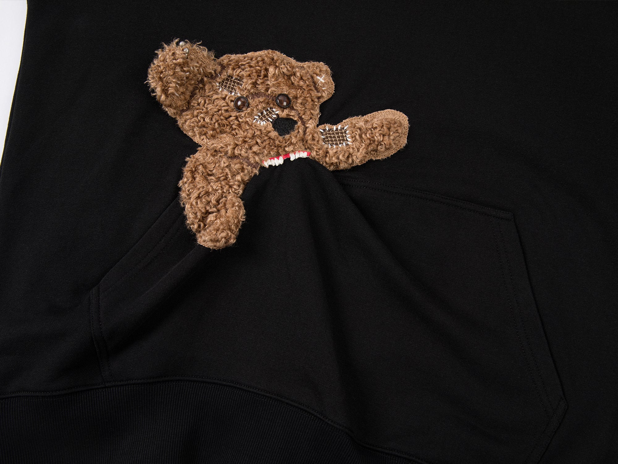 Hoodie with a little puppy biting the pocket