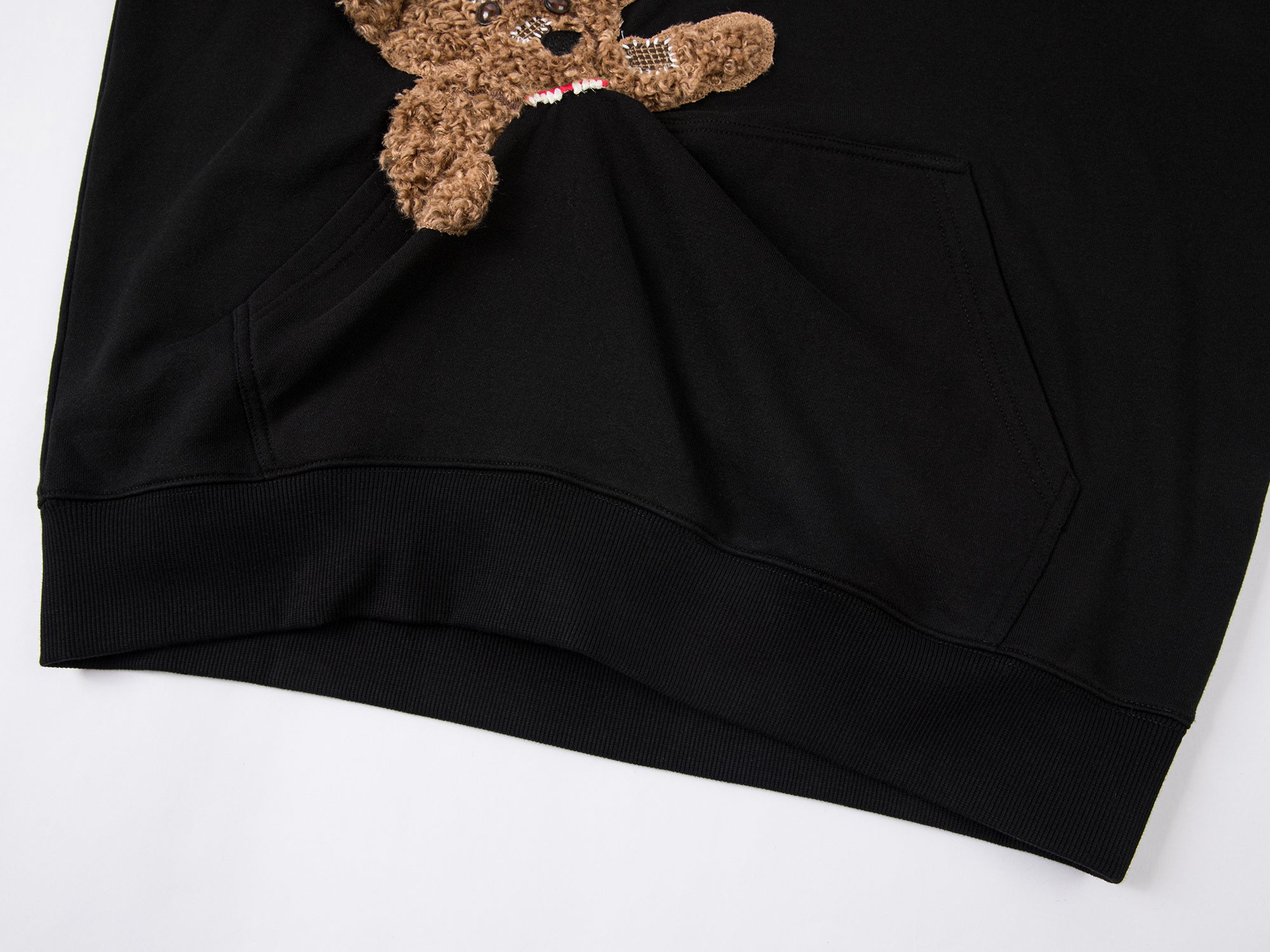 Hoodie with a little puppy biting the pocket