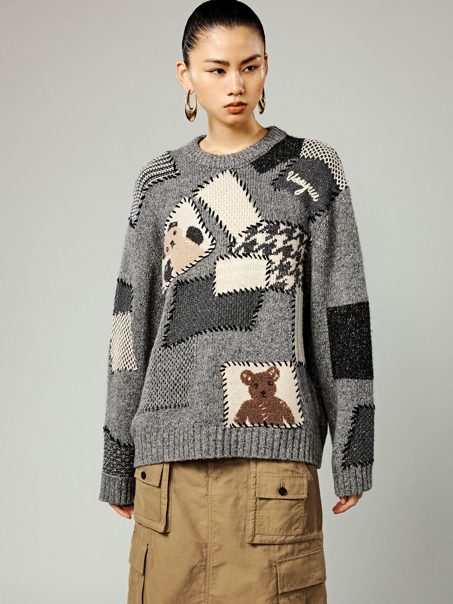 Vintage-inspired knit sweater with patches