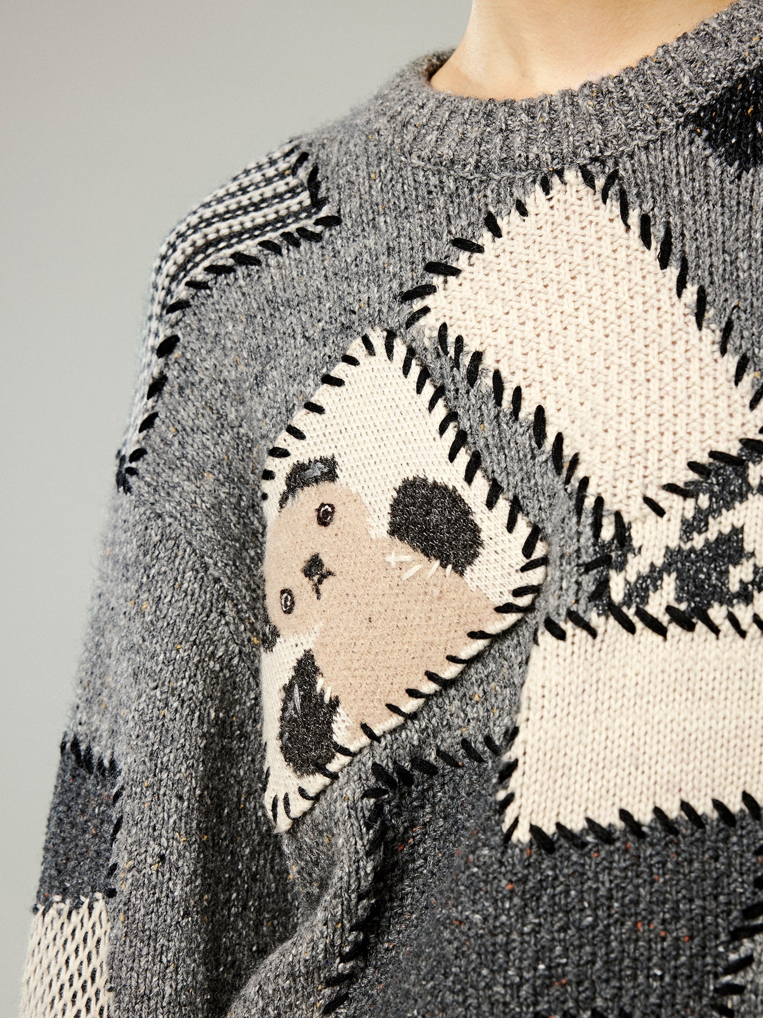 Vintage-inspired knit sweater with patches