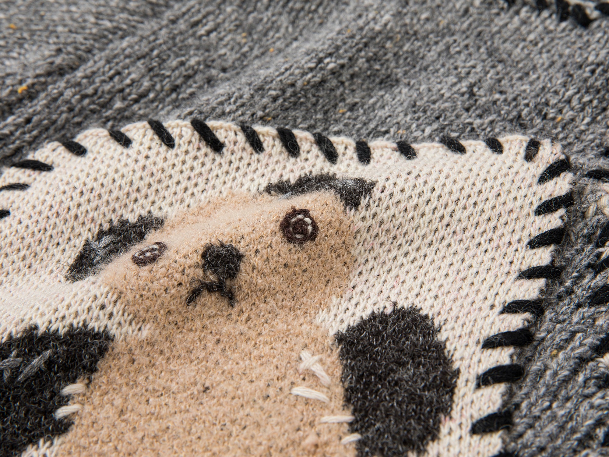 Vintage-inspired knit sweater with patches