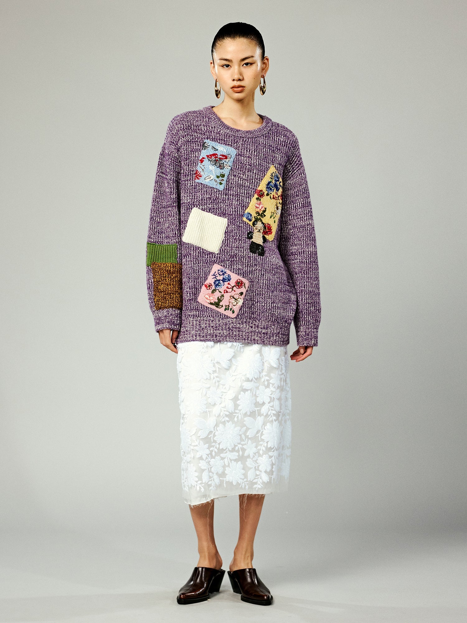 Vintage-inspired knit sweater with patches