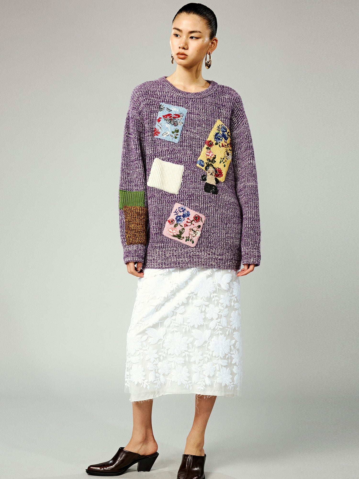 Vintage-inspired knit sweater with patches