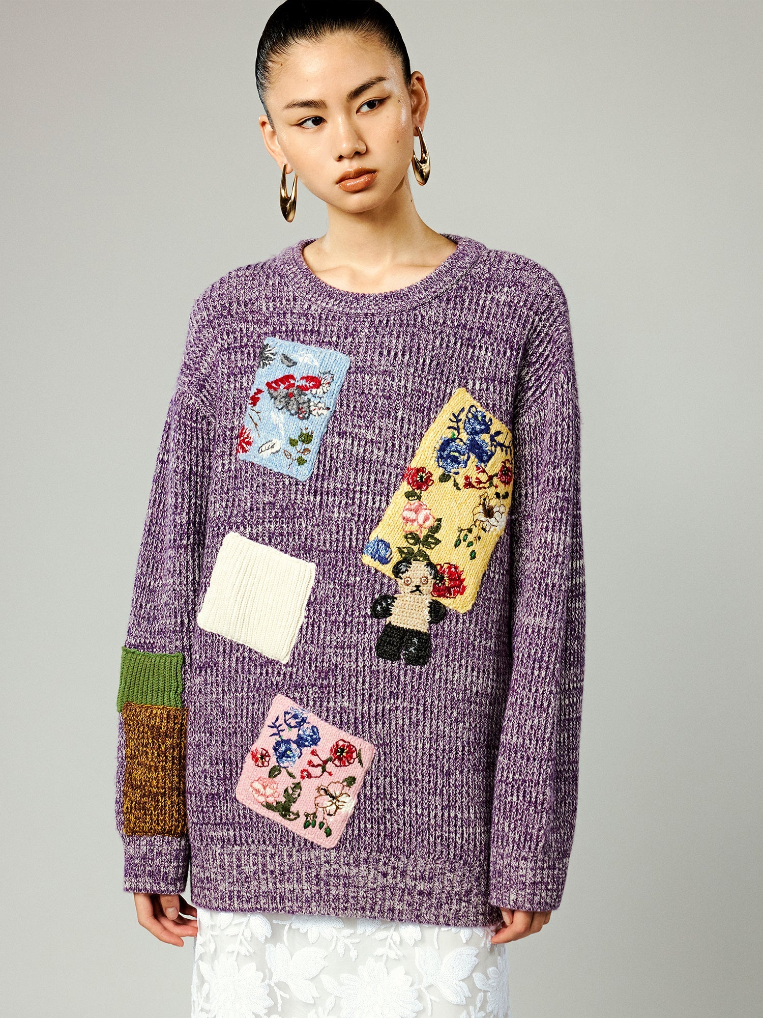 Vintage-inspired knit sweater with patches