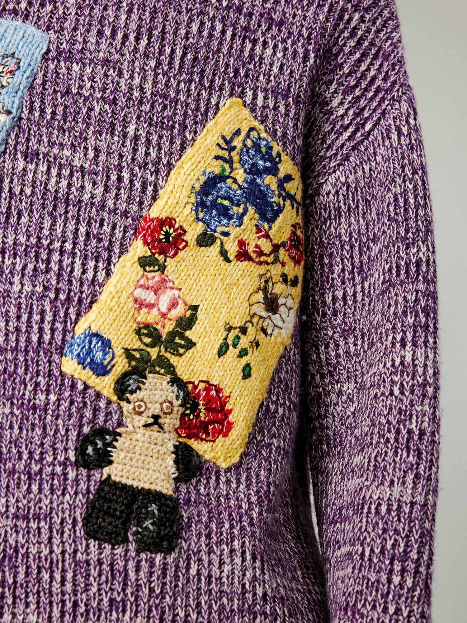 Vintage-inspired knit sweater with patches