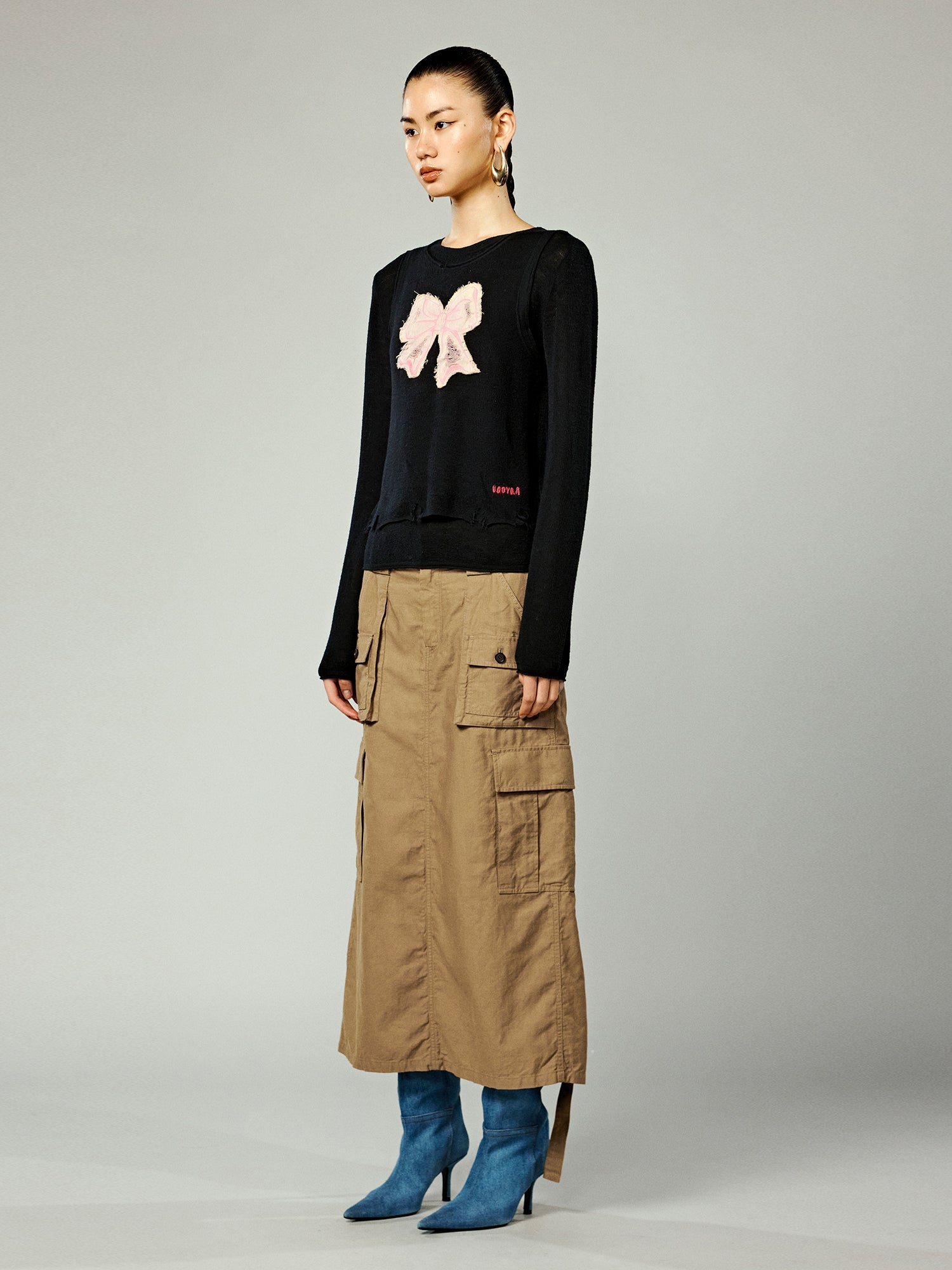 Distressed faux-layered bow sweater