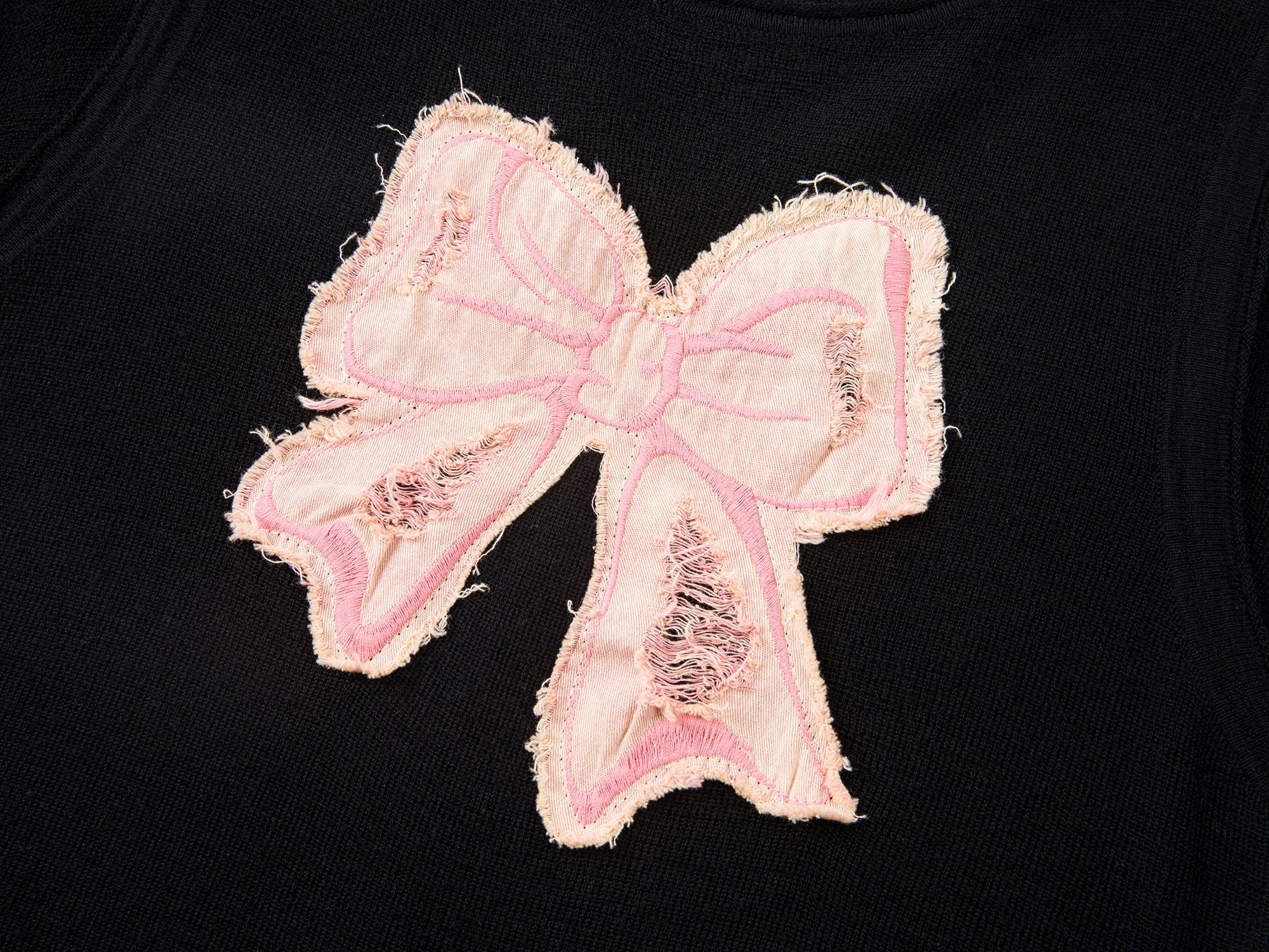 Distressed faux-layered bow sweater