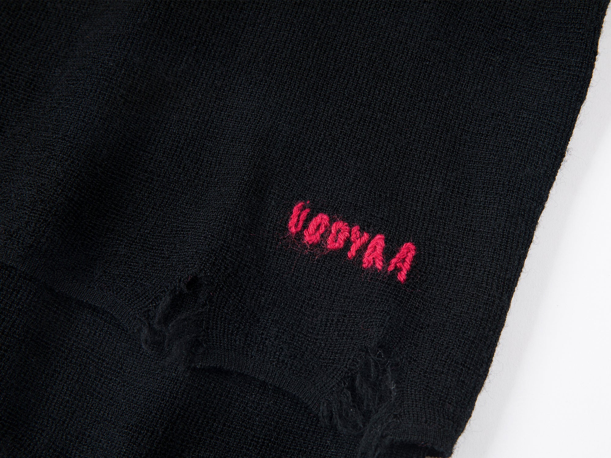 Distressed faux-layered bow sweater