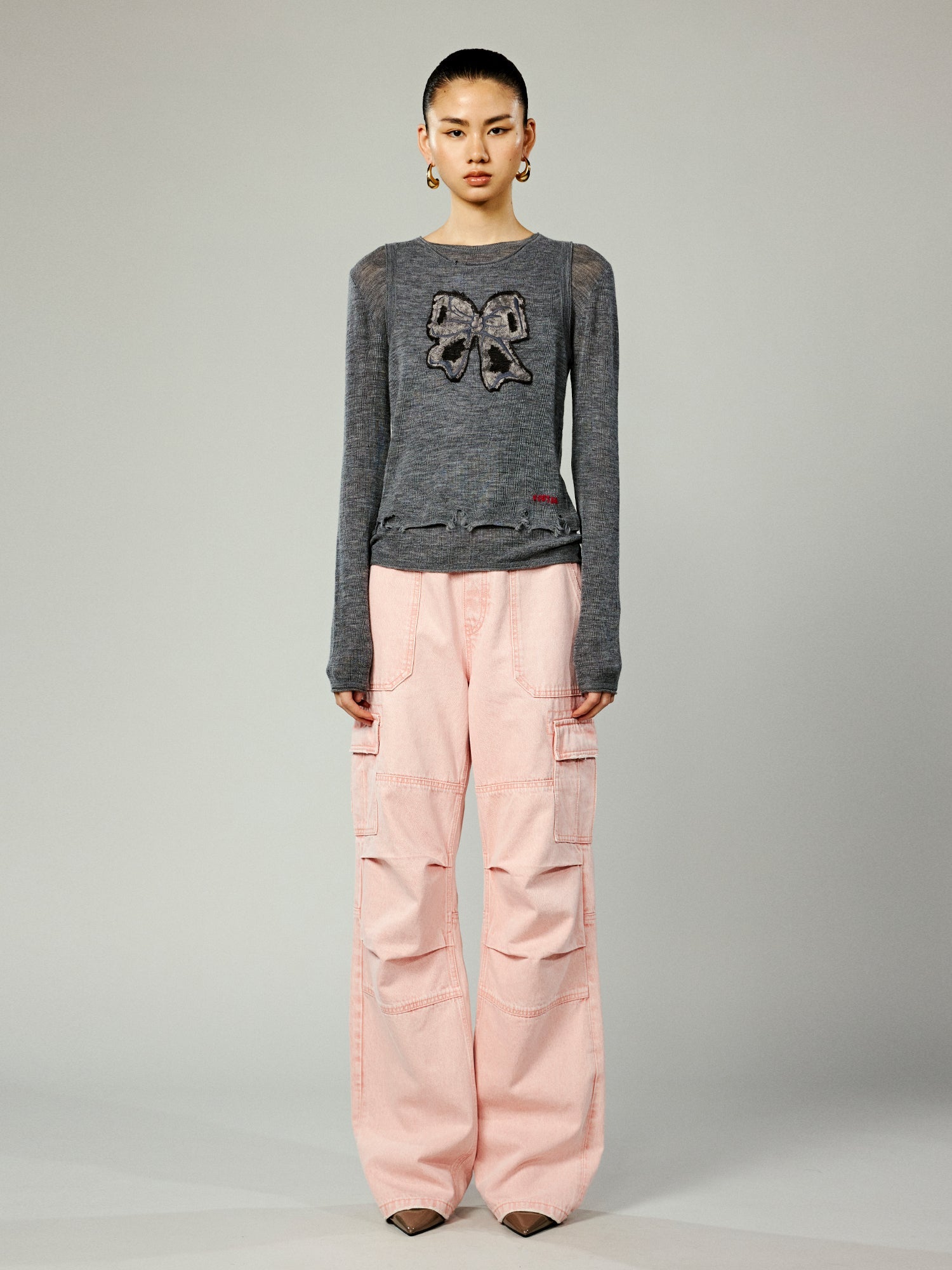 Faux-layered washed pullover sweater with bow detail