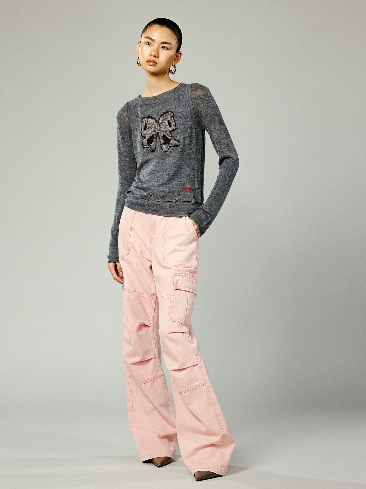 Faux-layered washed pullover sweater with bow detail