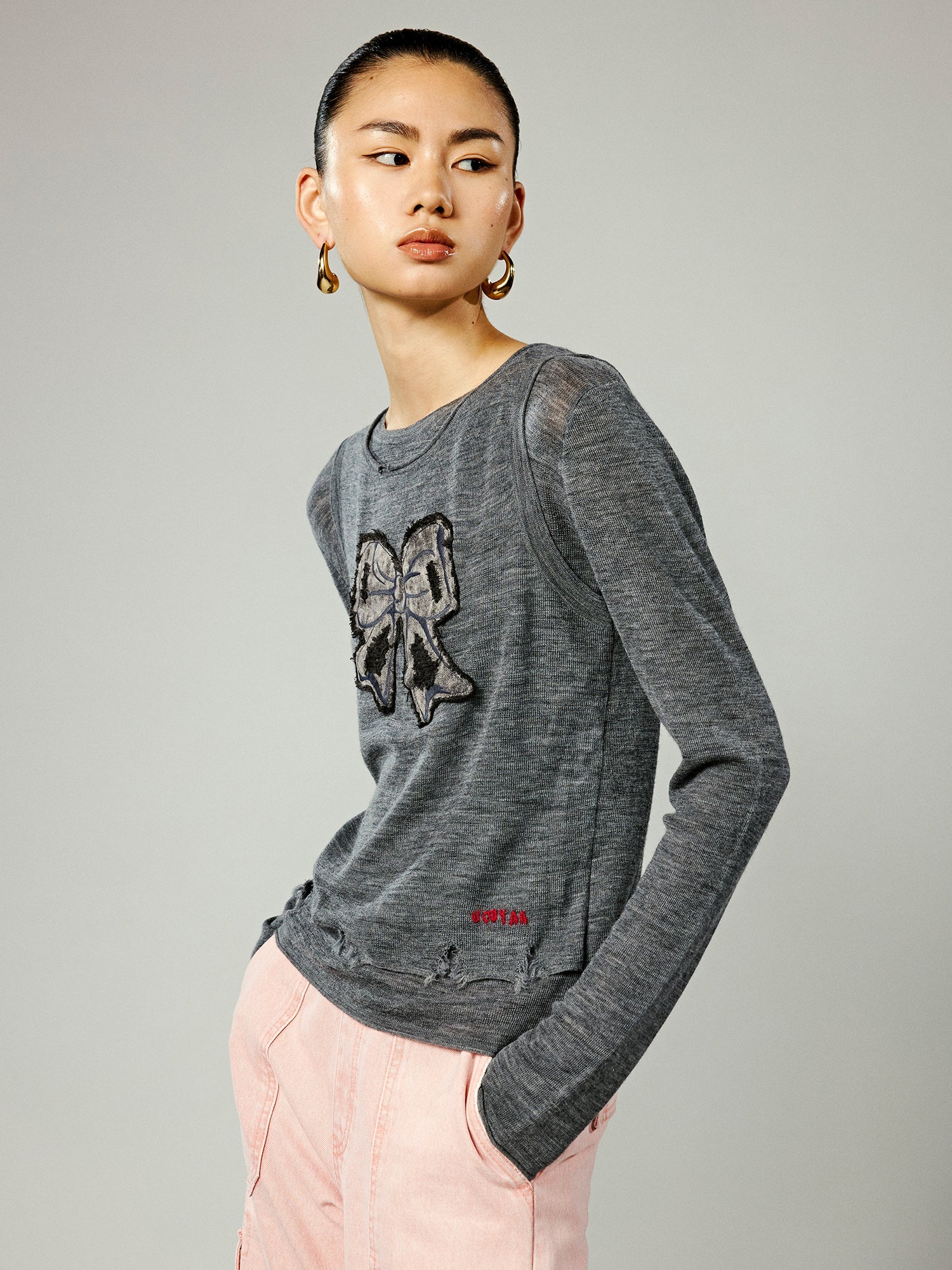 Faux-layered washed pullover sweater with bow detail