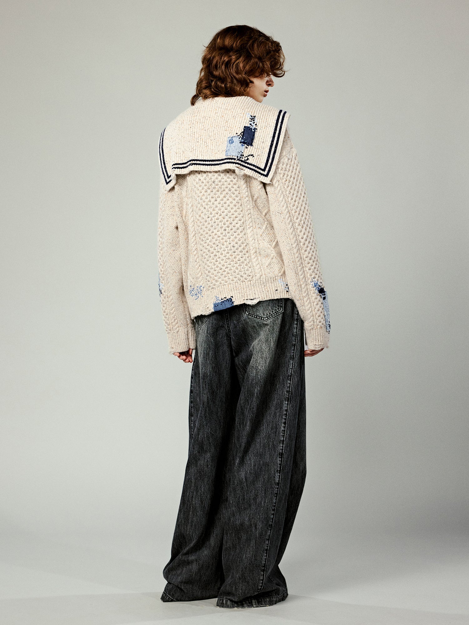 Structured side-pleat belted jeans