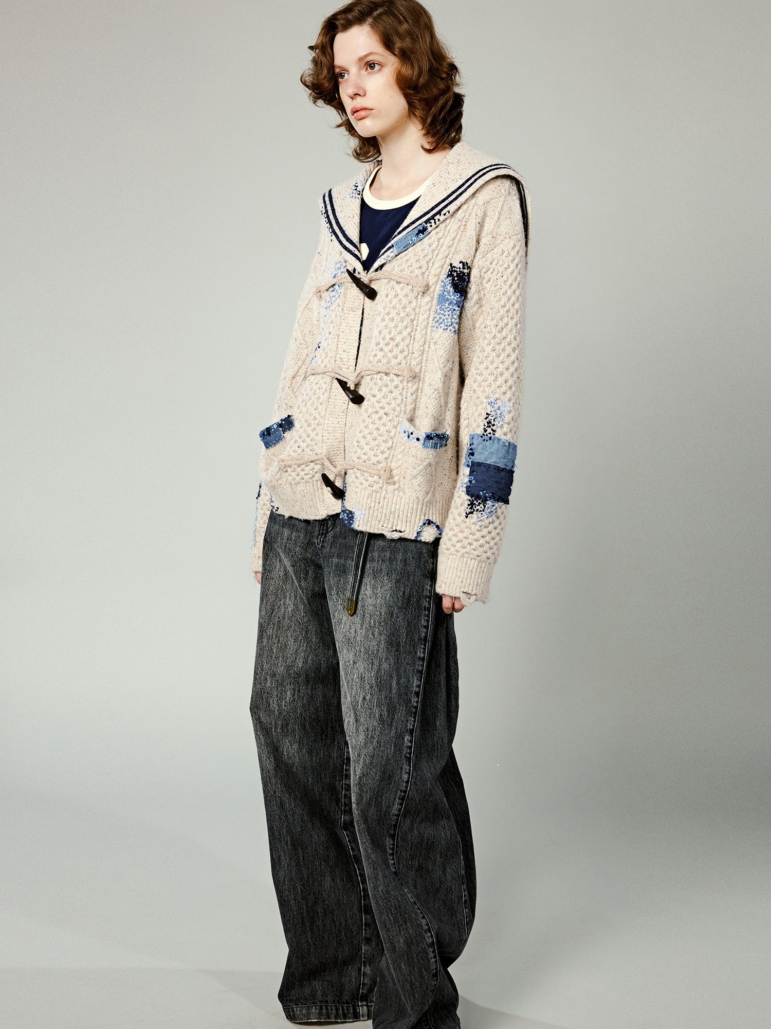 Structured side-pleat belted jeans