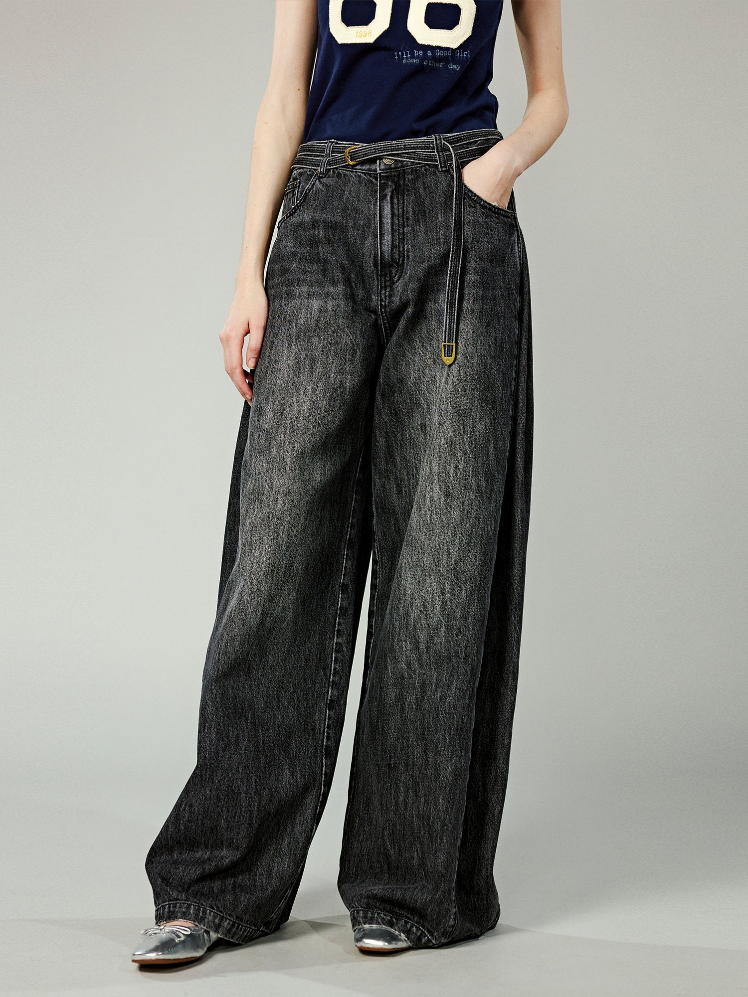 Structured side-pleat belted jeans