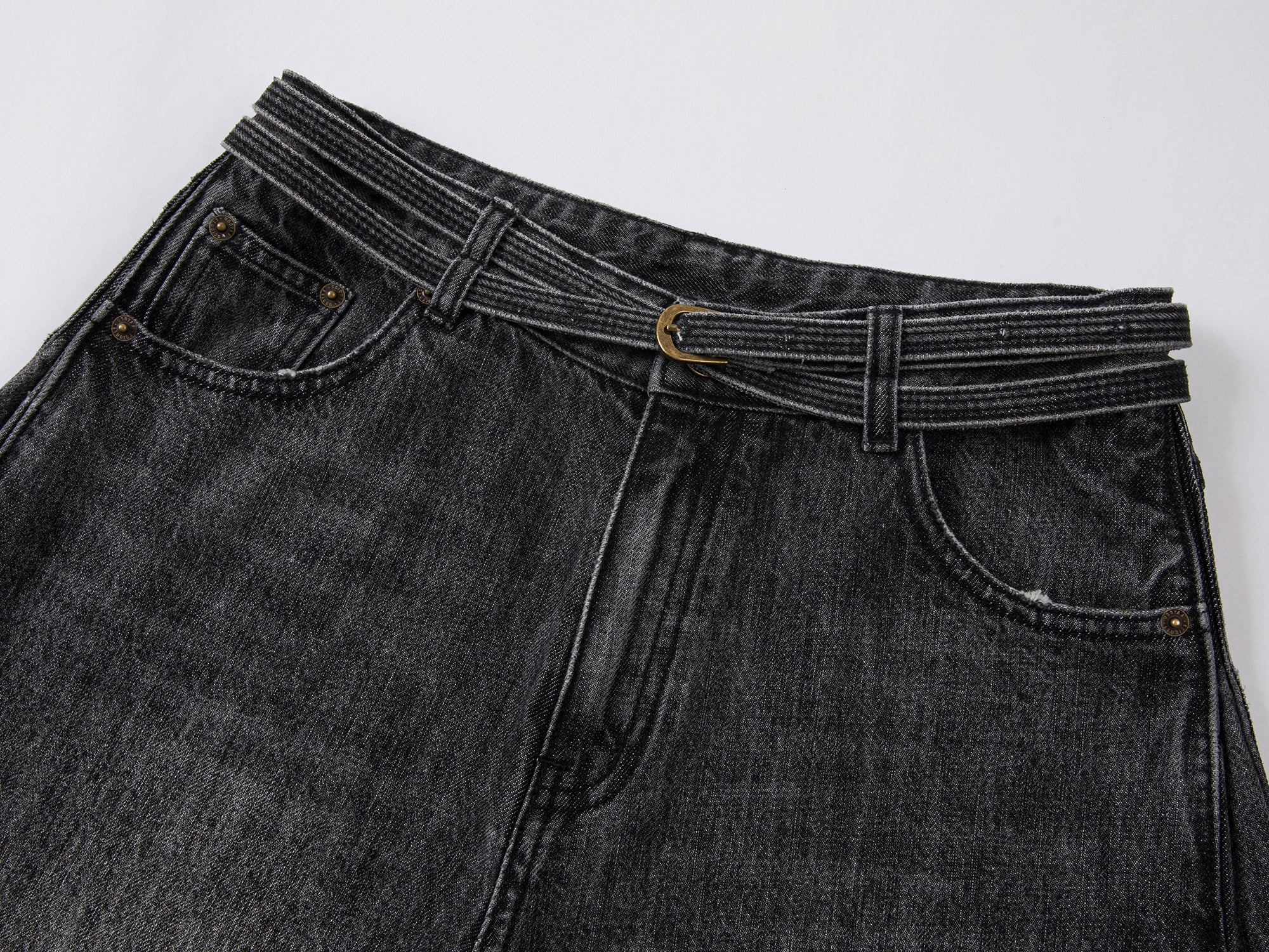 Structured side-pleat belted jeans