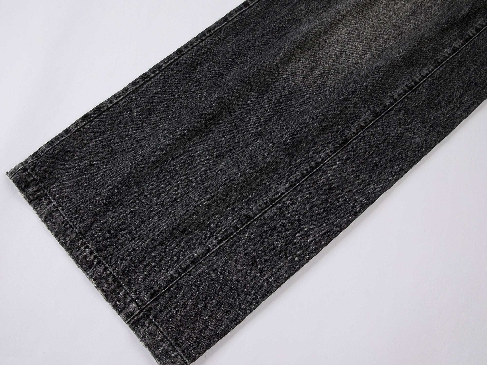 Structured side-pleat belted jeans