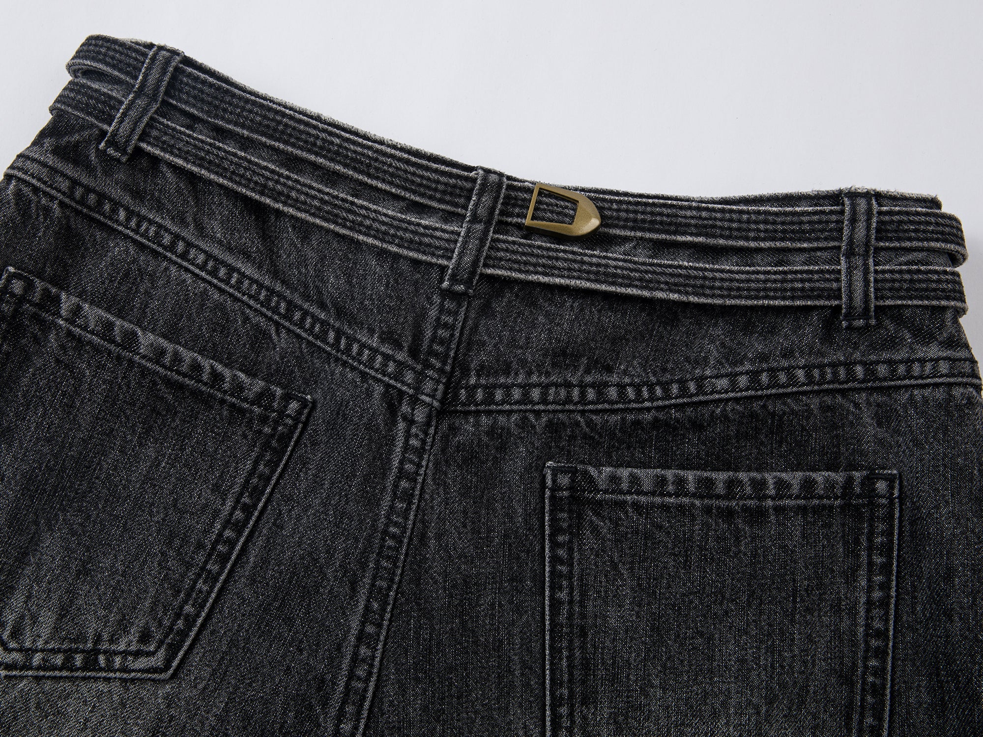 Structured side-pleat belted jeans