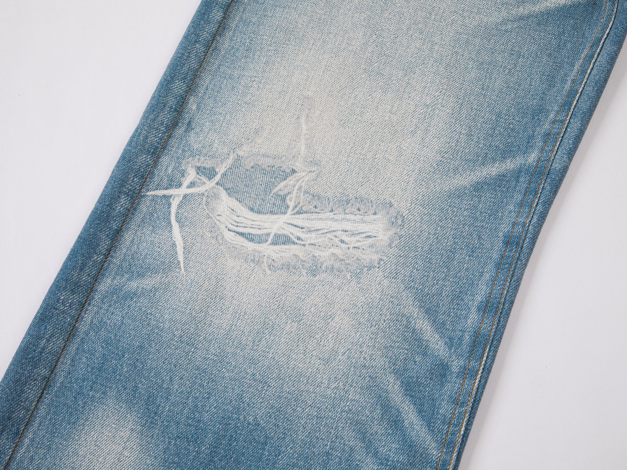 Trompe l'oeil chain print jeans