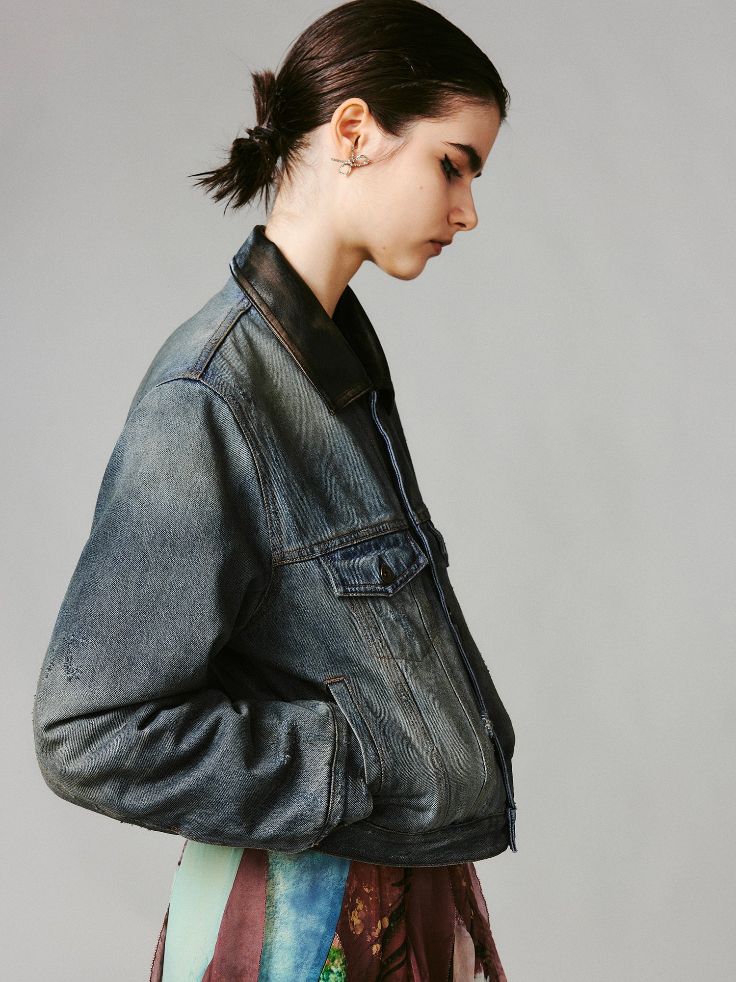 Washed and distressed quilted denim jacket