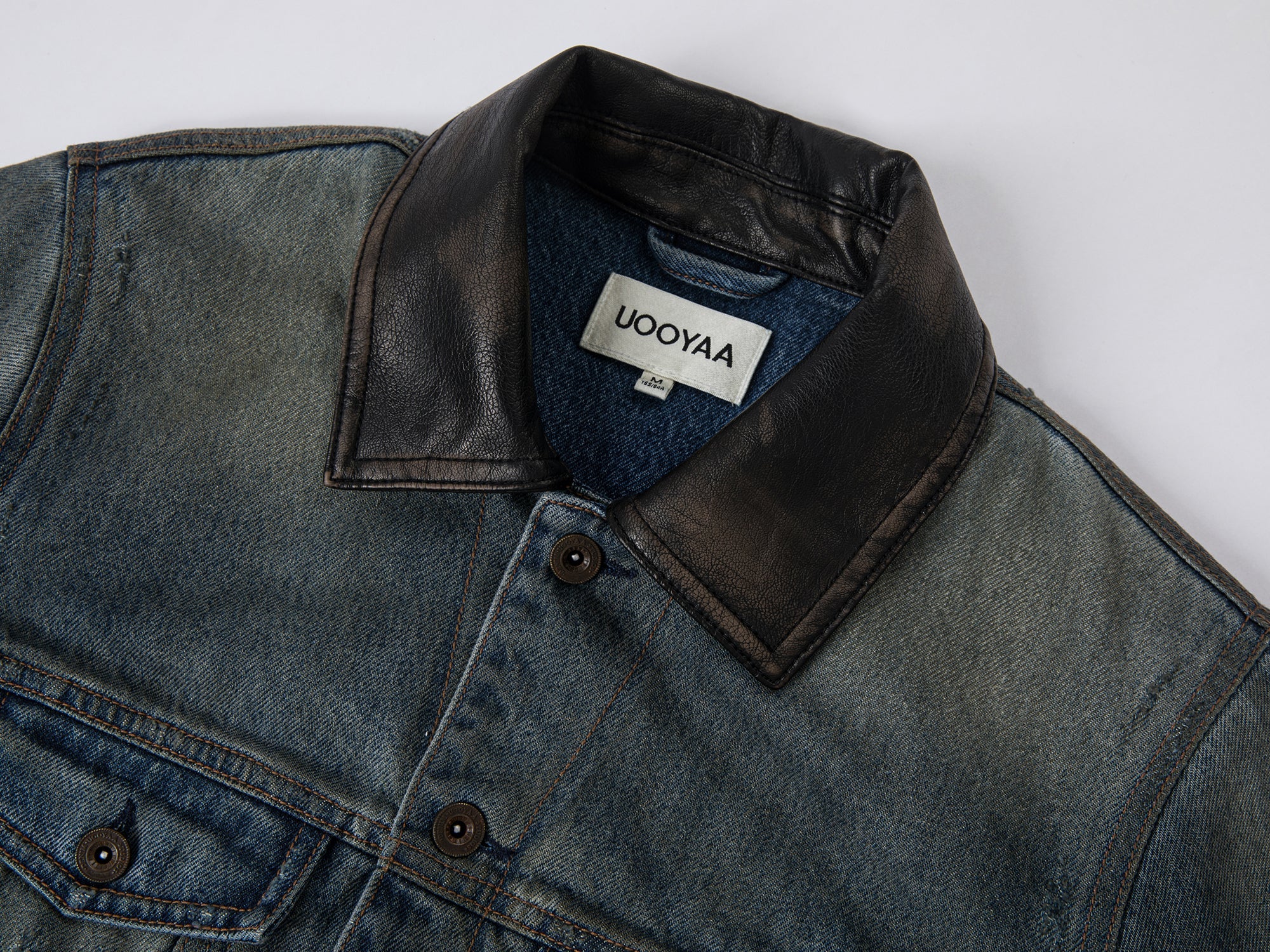 Washed and distressed quilted denim jacket