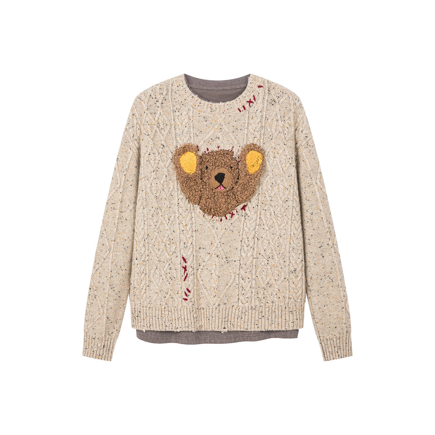 Teddy bear peeking through sweater