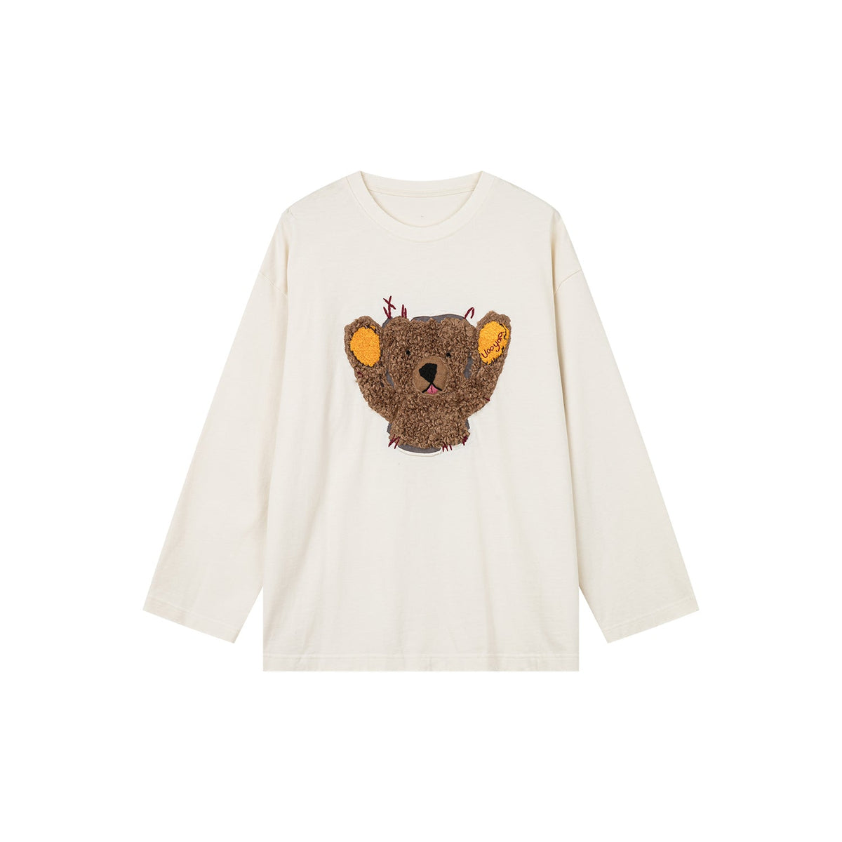 Teddy bear peeking through long-sleeve T-shirt