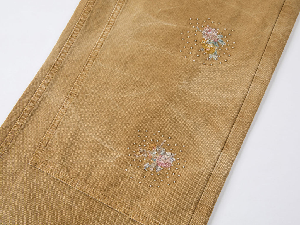 花柄の刺繍とビーズが施されたワークウェアパンツ