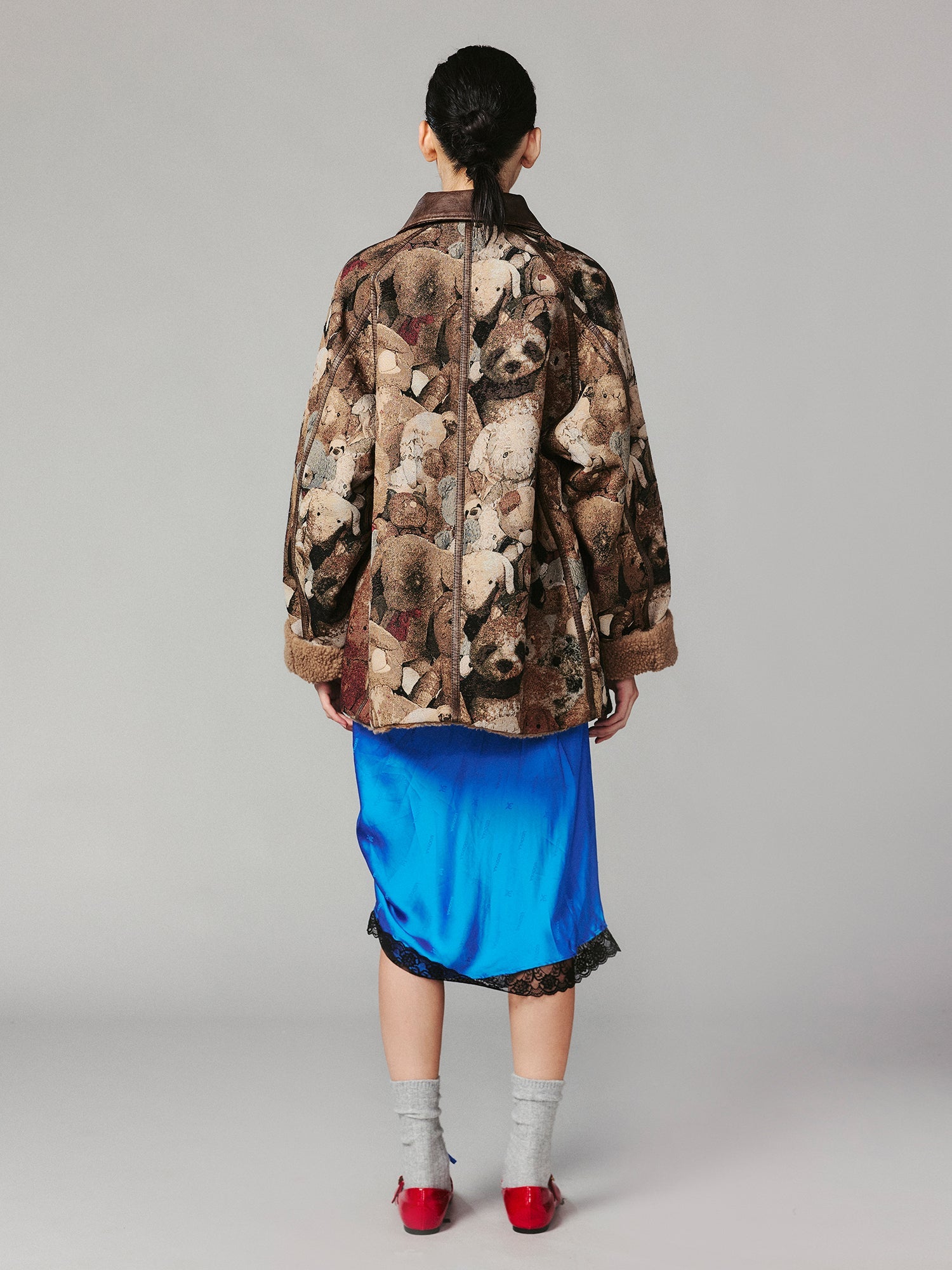 M35 blanket jacket covered with vintage plush toys