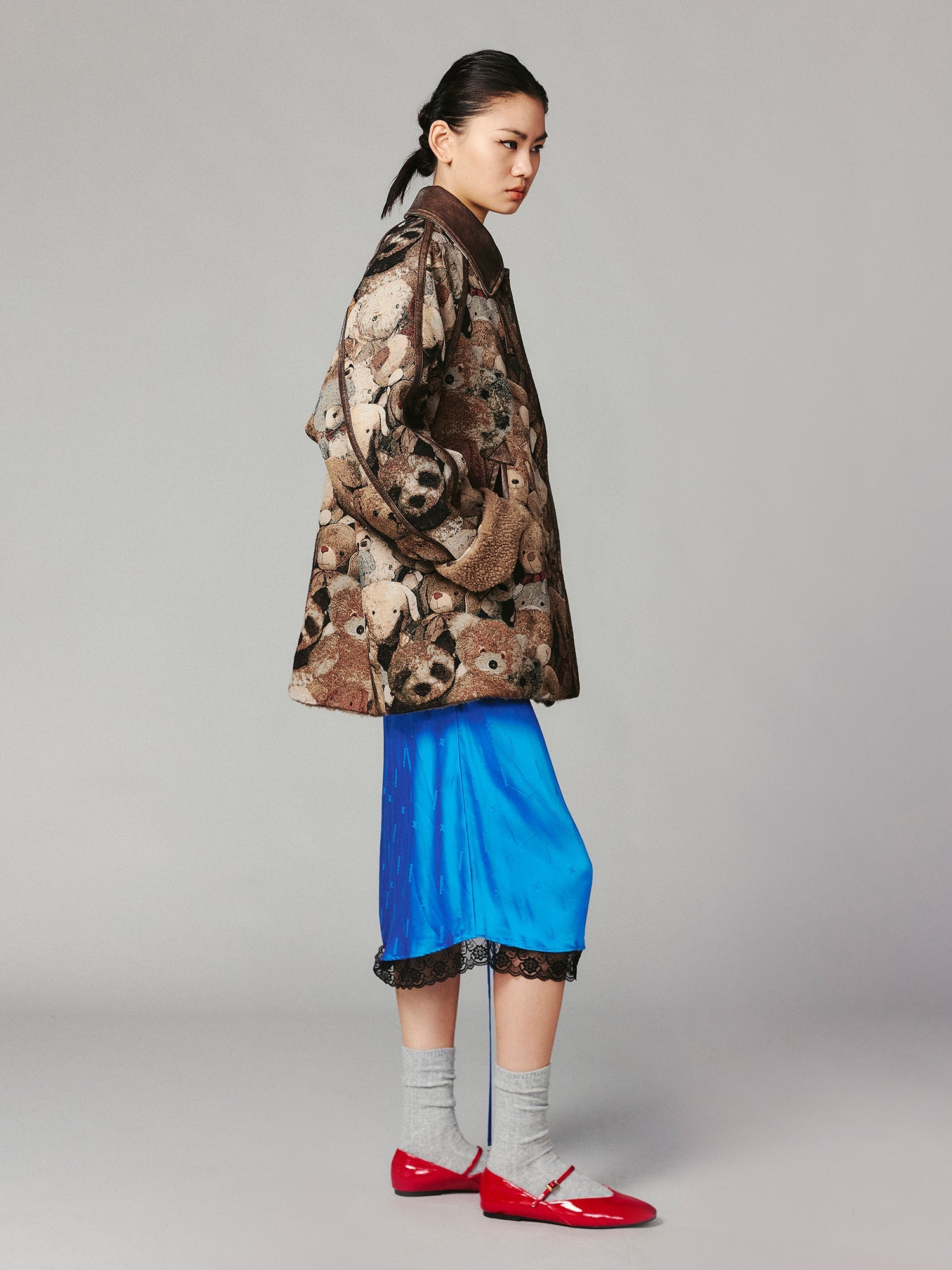 M35 blanket jacket covered with vintage plush toys