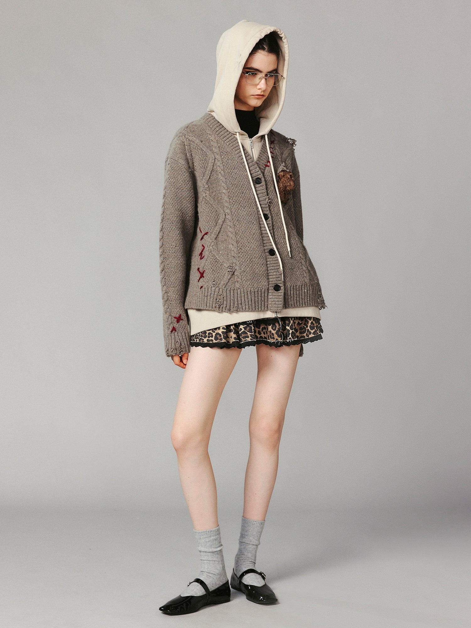 Layered look cable-knit hoodie with 3D bear peeking through