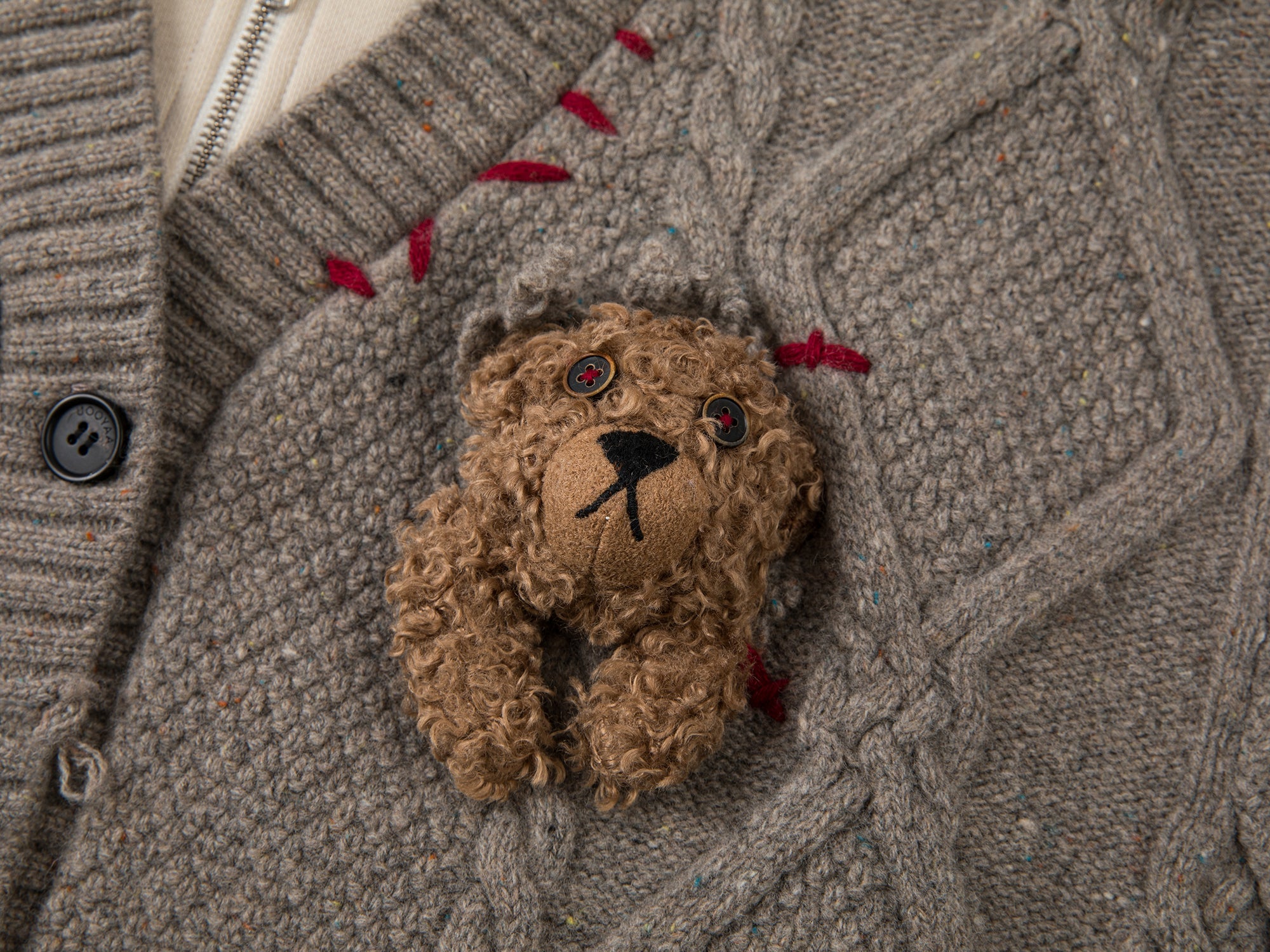 Layered look cable-knit hoodie with 3D bear peeking through