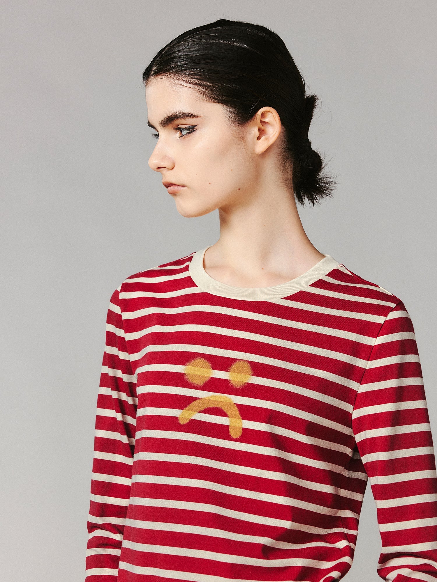 Striped sad face t-shirt