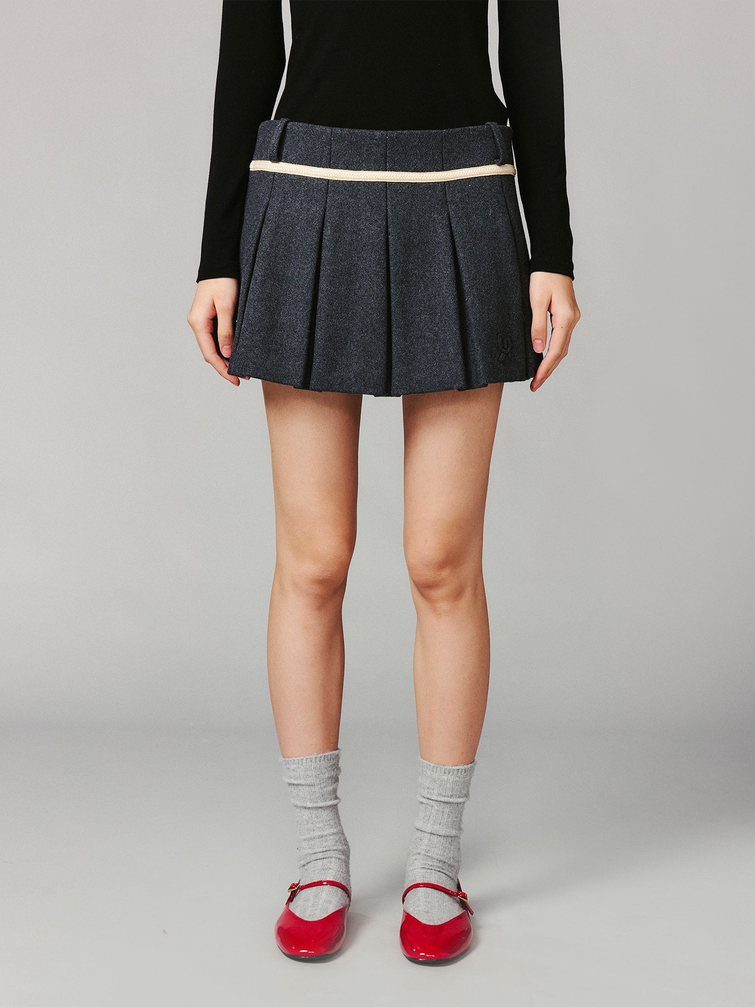 School-style pleated wool skirt
