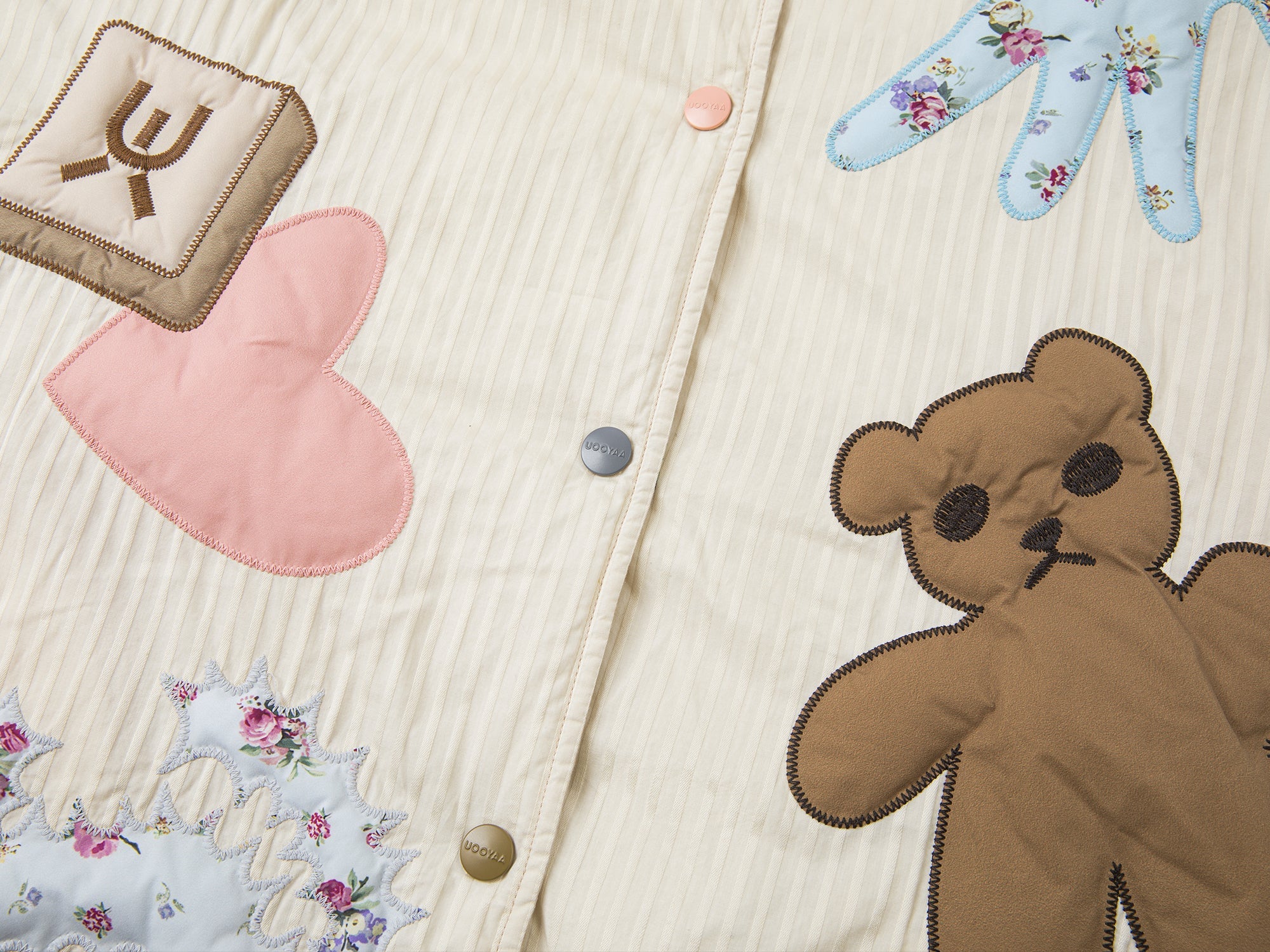 Reversible puffer jacket embroidered with childhood dolls and vintage wallpaper print