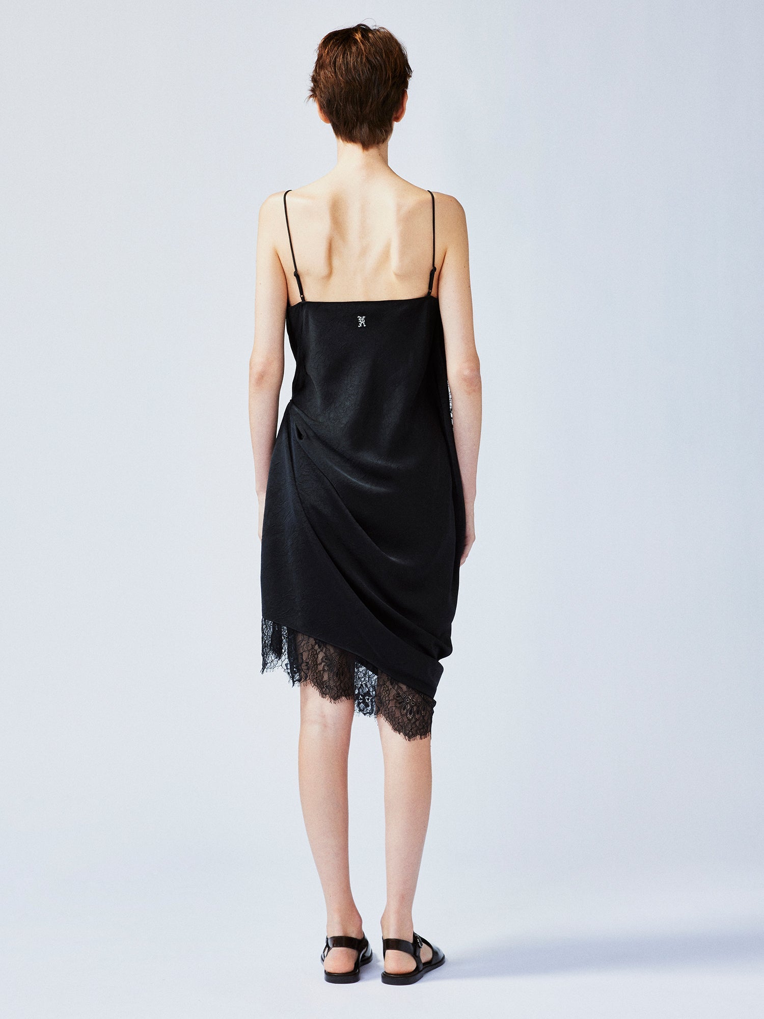 Lace-trimmed slip dress with casually lifted hem