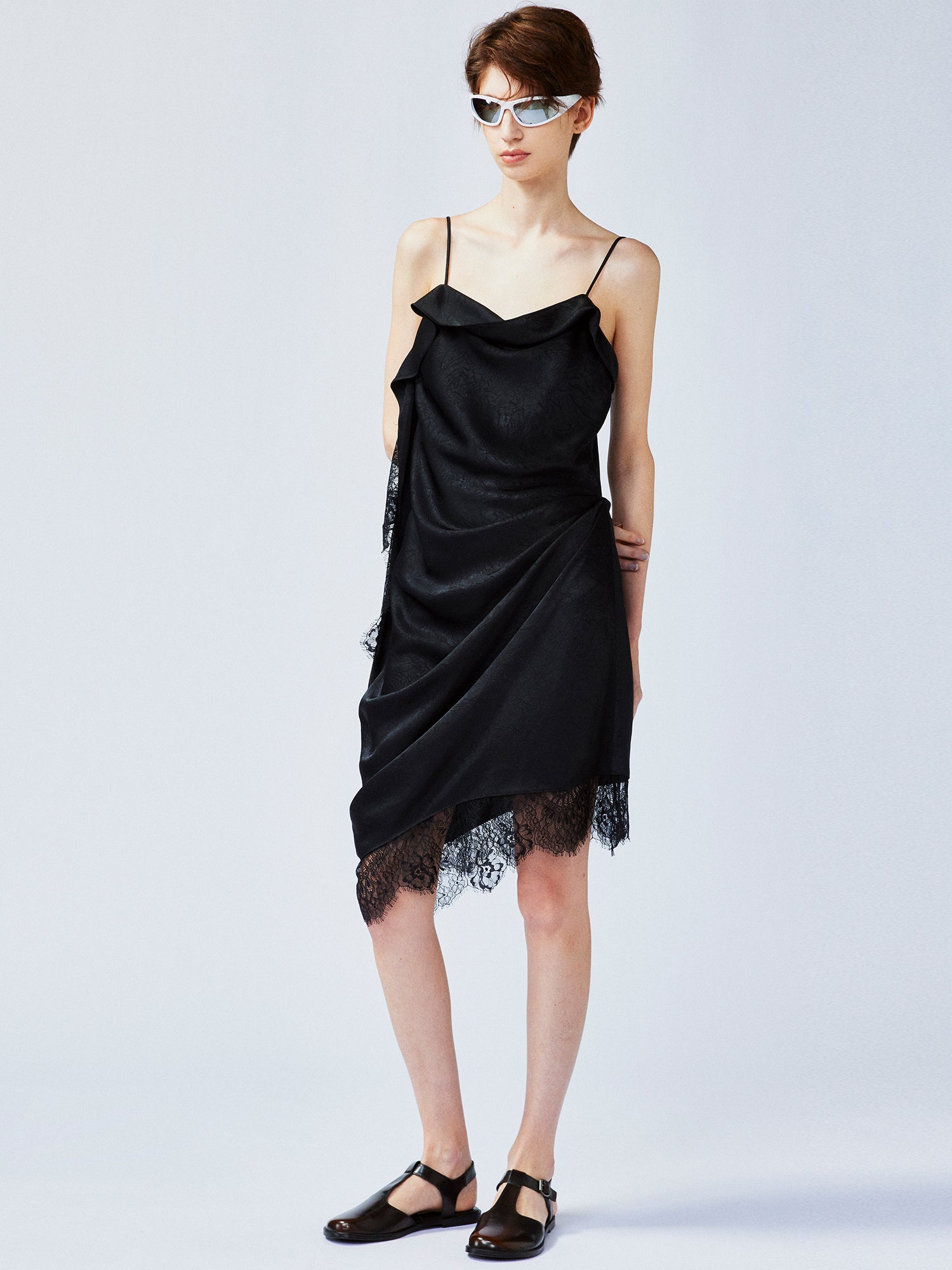 Lace-trimmed slip dress with casually lifted hem
