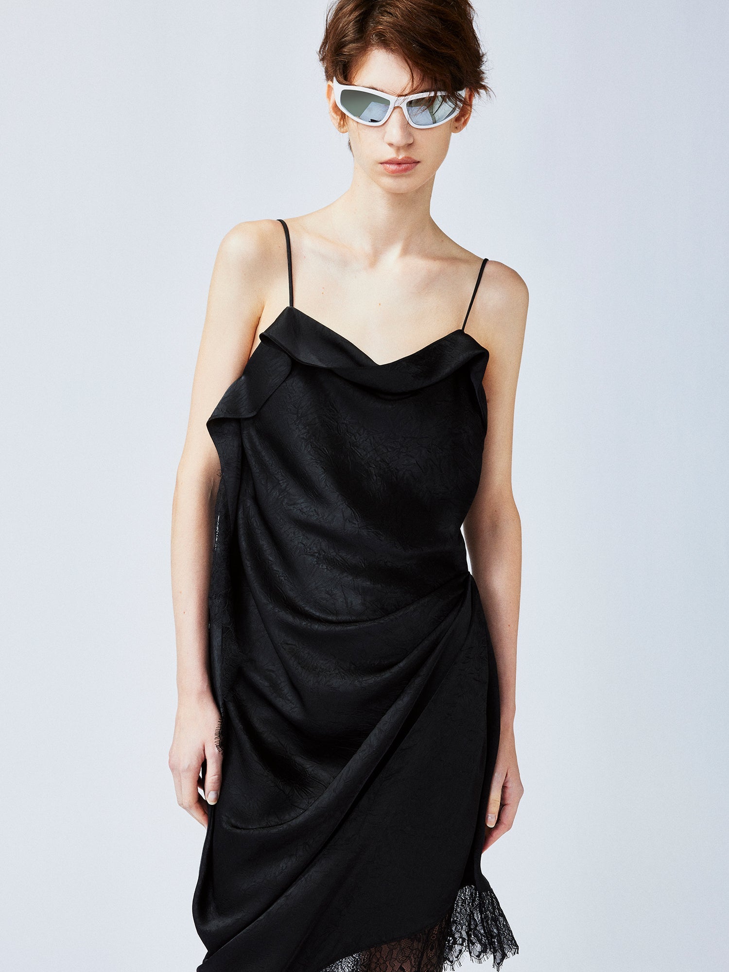 Lace-trimmed slip dress with casually lifted hem