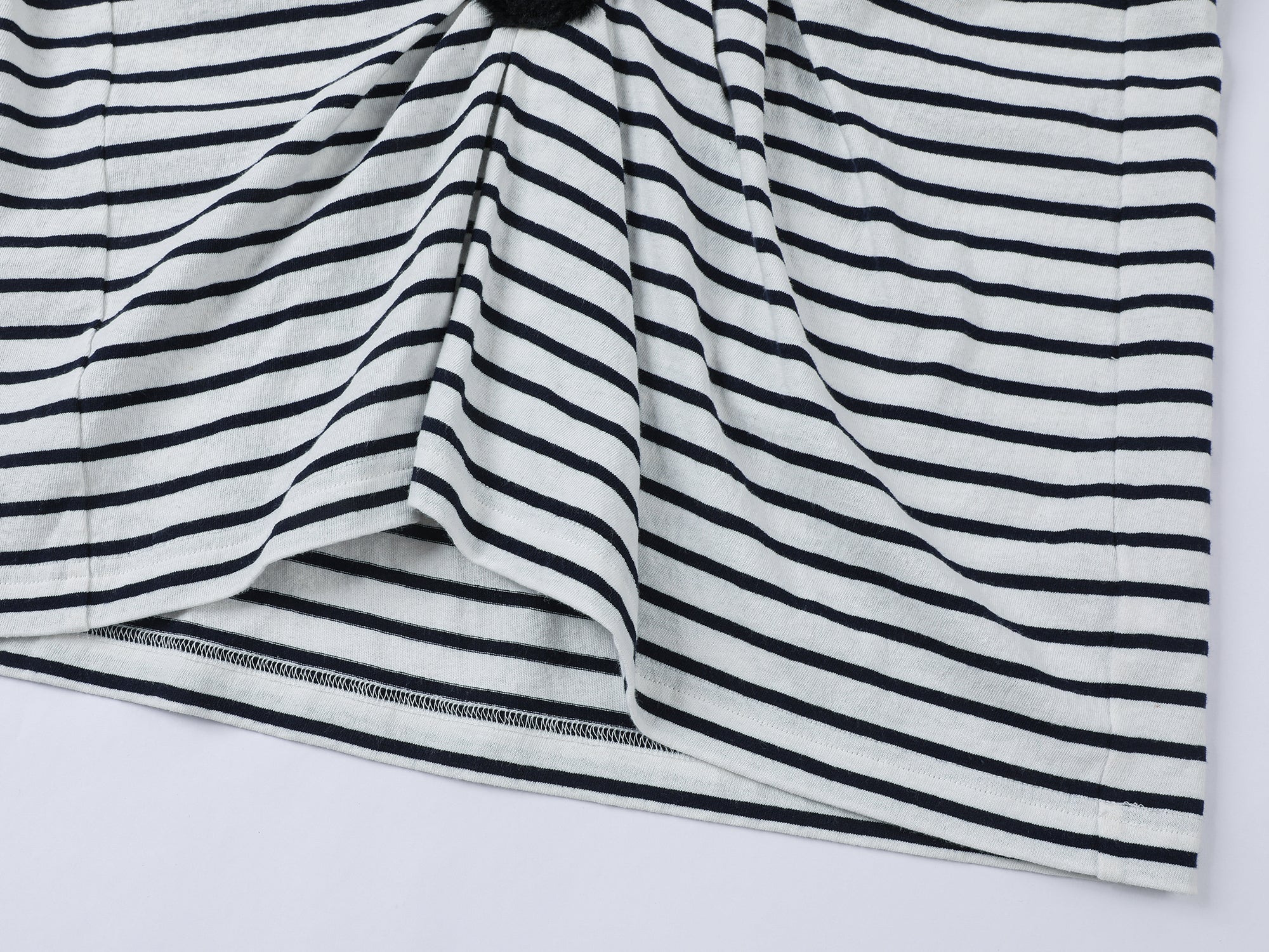 Playful cat scratching bedsheet striped T-shirt