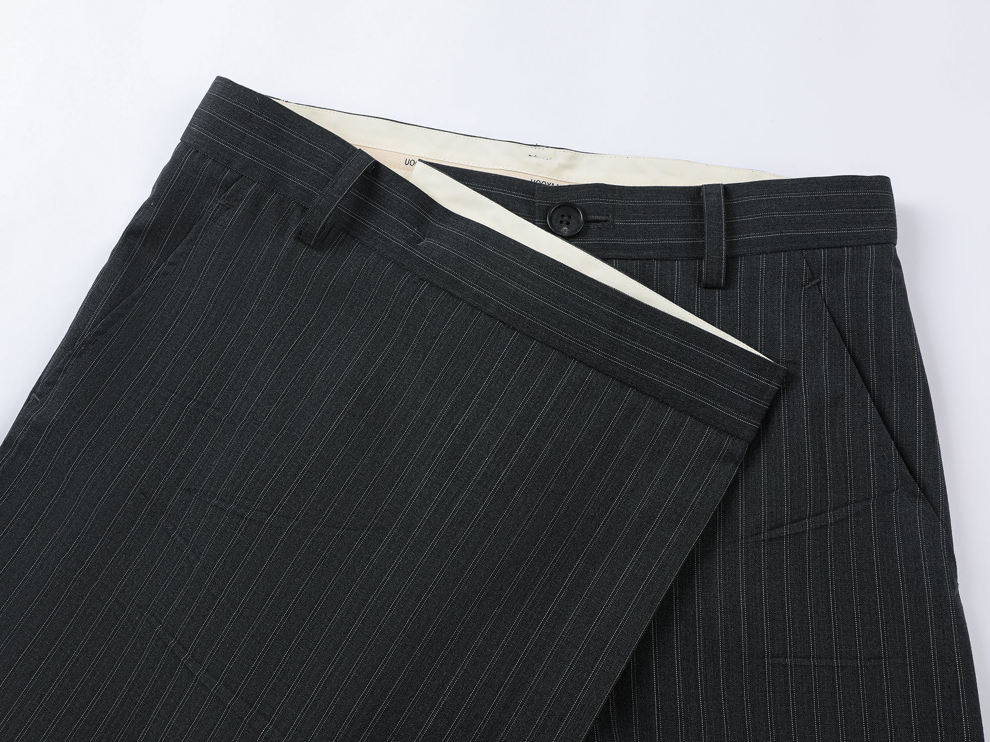 Pulled pleated suit pants with authentic wear marks