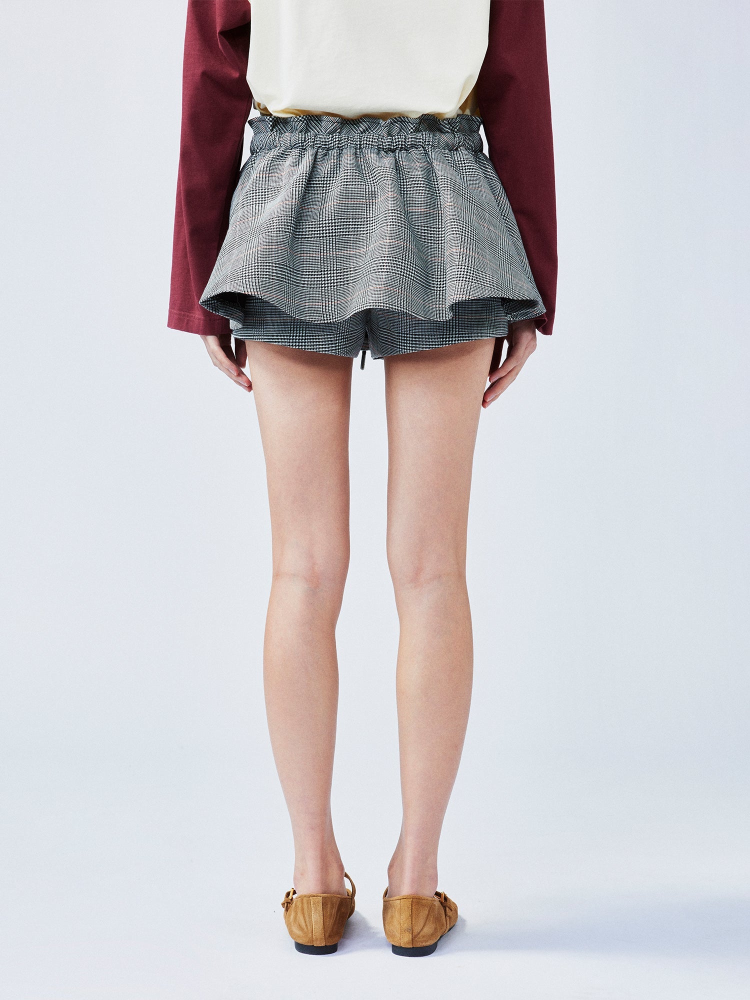 Playful and stylish finely woven plaid mini skirt with a hidden twist
