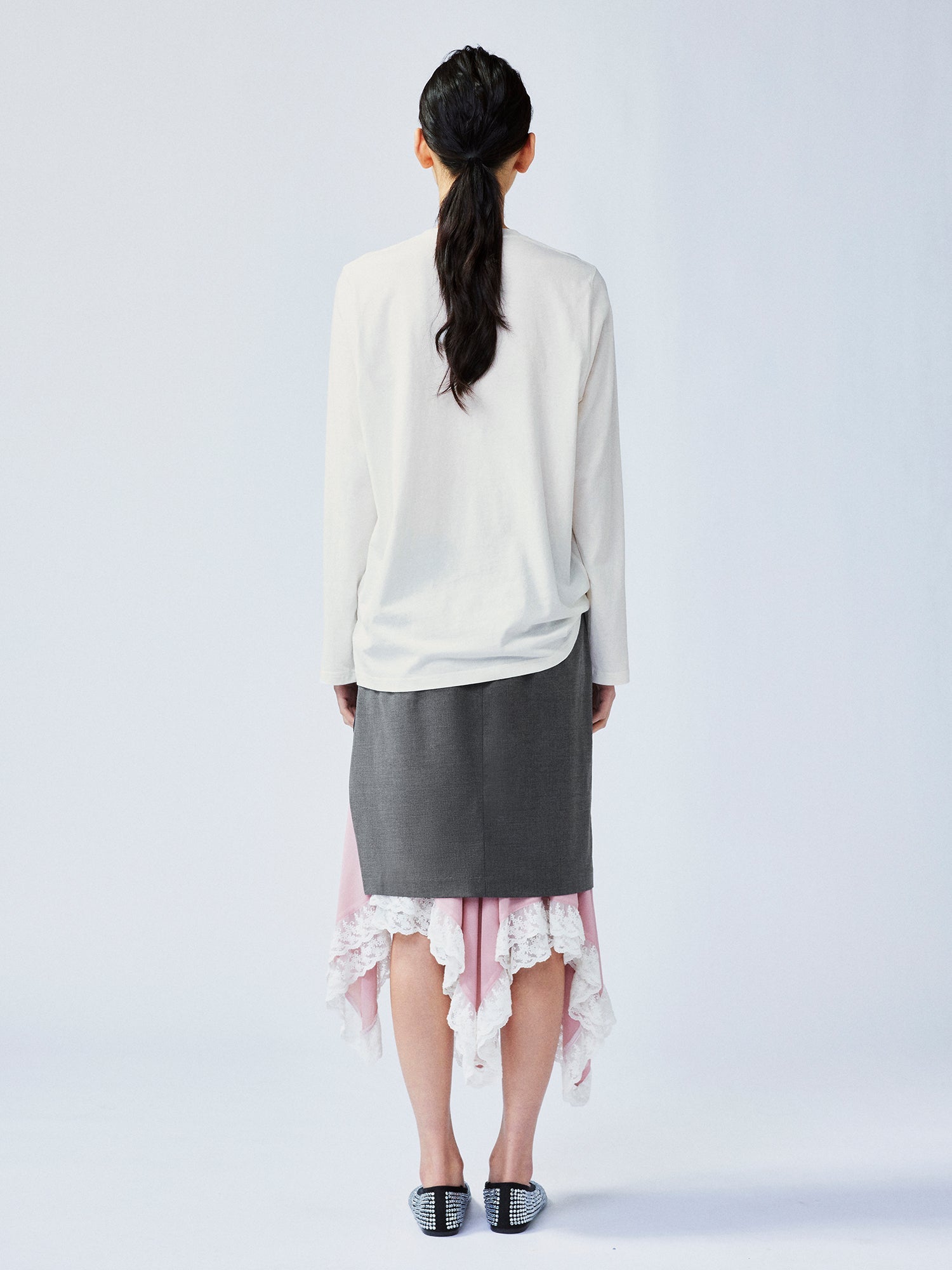 A misaligned suit layered-look skirt