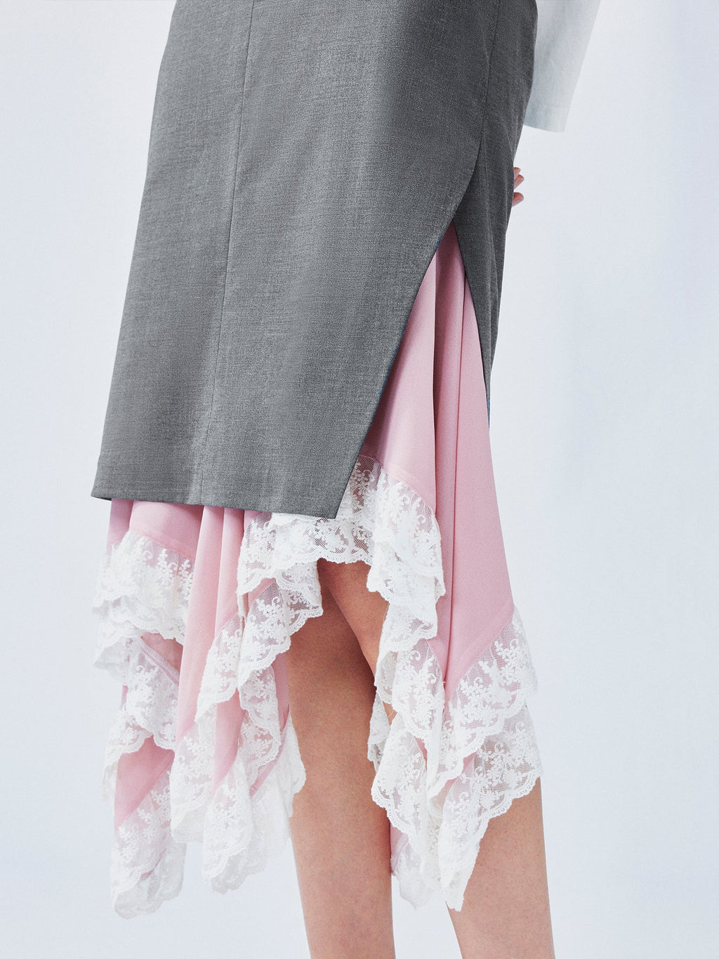 A misaligned suit layered-look skirt