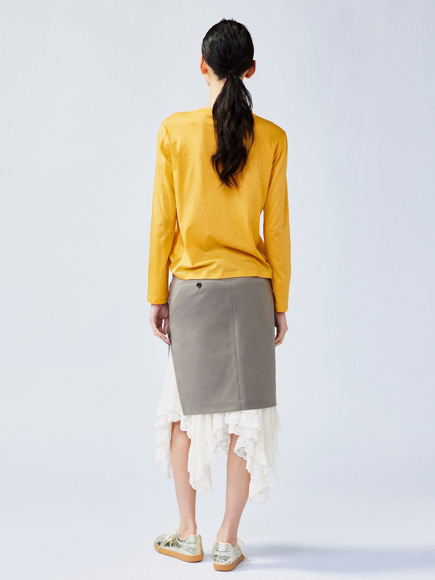 A misaligned suit layered-look skirt